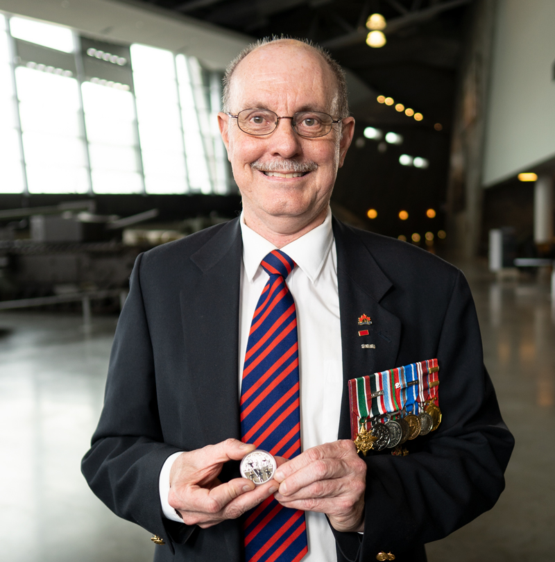 image When the Royal Canadian Mint first called retired Military Engineer Warrant Officer Ed Storey, CD asking him to be a historical advisor on a military coin, he knew his lifelong “pack rat” tendency had finally found its purpose. He believes it’s important to remember Canada’s sacrifices and achievements, and that realistic, accurate details on coins can help draw people in and give the depicted events a kind of immediacy. The 2020 Fine Silver Proof Dollar honouring the 75th anniversary of V-E Day is a great example of that, placing those who fought on the front lines in the spotlight while also drawing the viewer into the celebratory scene behind them. It’s that party atmosphere that resonates most with Storey.