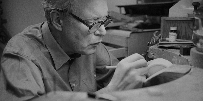 Bill Reid reconstructing a section of Haida Village - Photo by Robert Keziere. Courtesy UBC Museum of Anthropology, Vancouver, Canada.